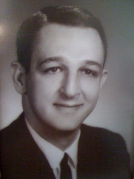 Fred Woodford, in a suit and tie