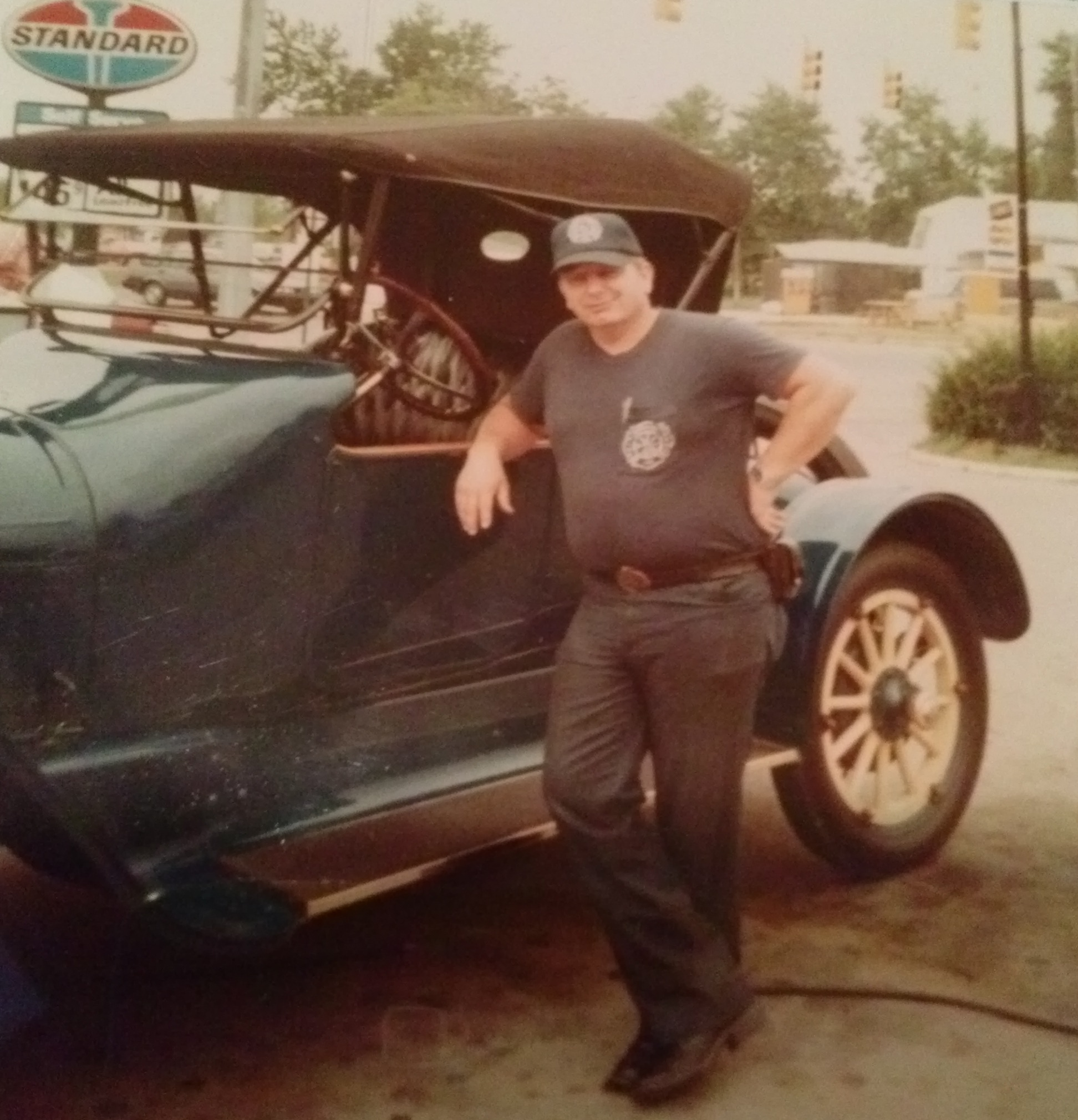 William lounging by a Model A convertible?