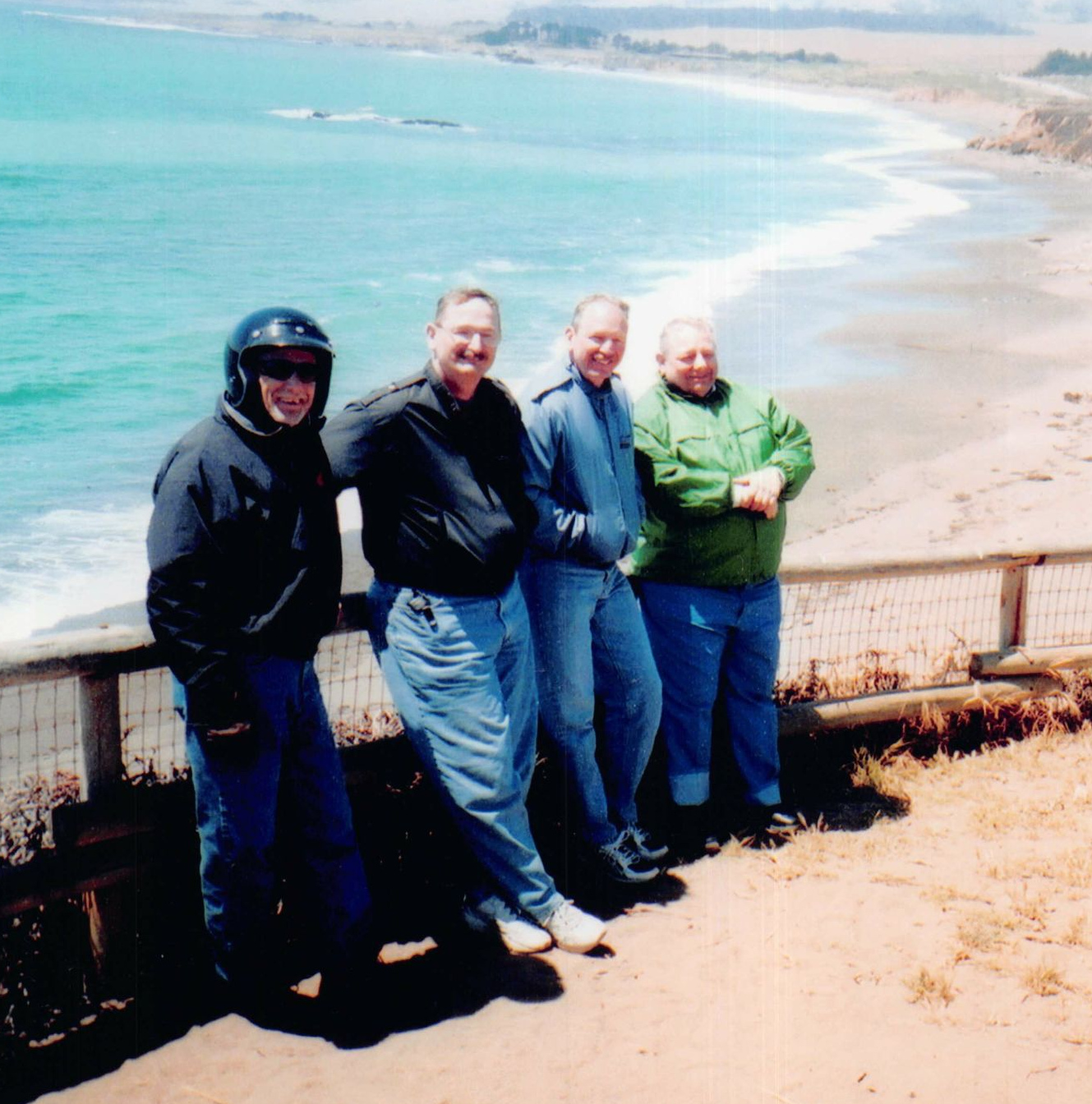 John wearing a helmet, Jim, Bob and William on the West coast of California.
