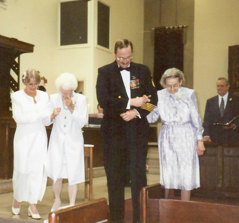 Judy with here mom, Jim with his mom, Walking down the aisle.